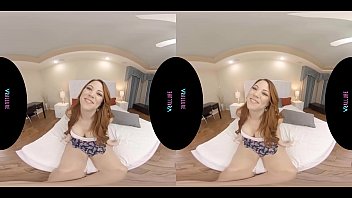 Busty redhead masturbates with her toy in virtual reality