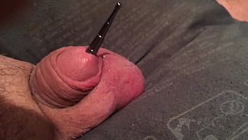 Sounding rod going in and out of my cock