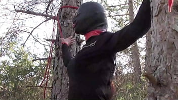 Laura on Heels model step sister in black dress and high heels bound and masked in a wood, has to suck a bick cock.
