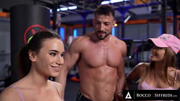 Ripped man Maximo Garcia gets flirted in the gym by two groupies Silvia Dellai and Lana Roy. These two horny beauties want to get their wet little pussies pounded.